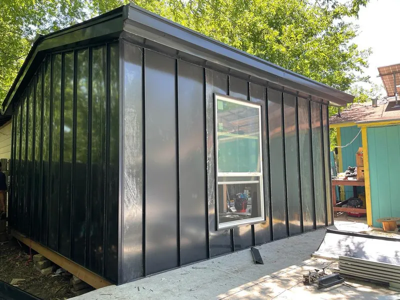 Black standing seam metal wall panels for Metal Roof Installation in Cicero